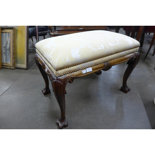 161 - A Chippendale Revival mahogany and fabric upholstered footstool