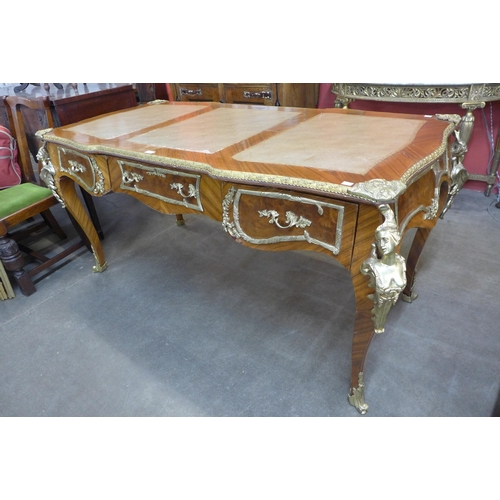 166 - A French Louis XV style kingwood and gilt metal mounted bureau plat