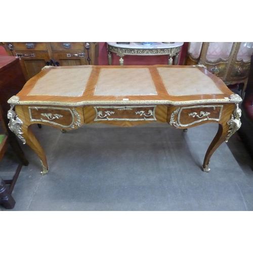 166 - A French Louis XV style kingwood and gilt metal mounted bureau plat