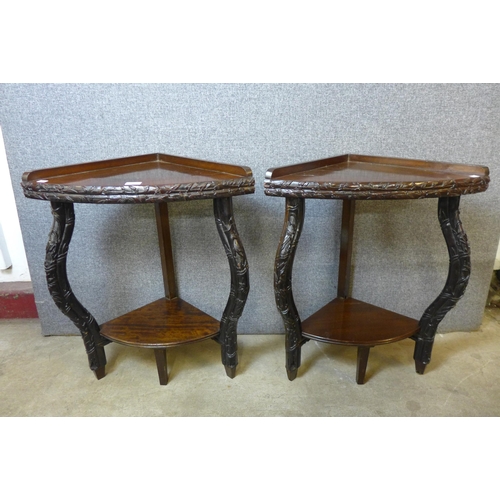 183 - A pair of 19th Century and later Chinese carved hardwood corner tables