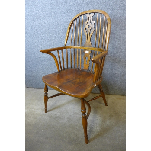 184 - A 19th Century style elm and oak Windsor chair