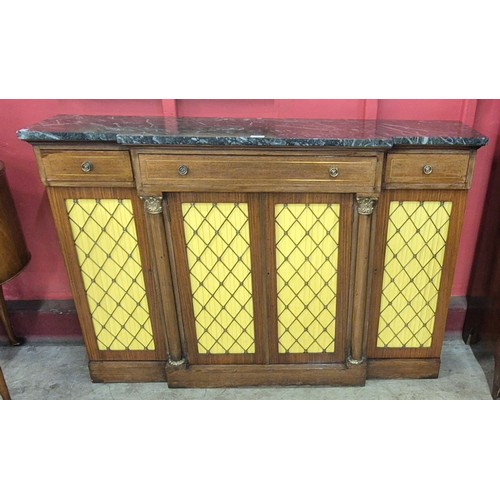 148 - A Regency style mahogany, gilt metal mounted and marble topped breakfront sideboard