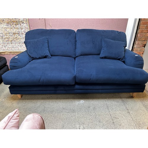 1519 - A marine velvet upholstered three seater sofa