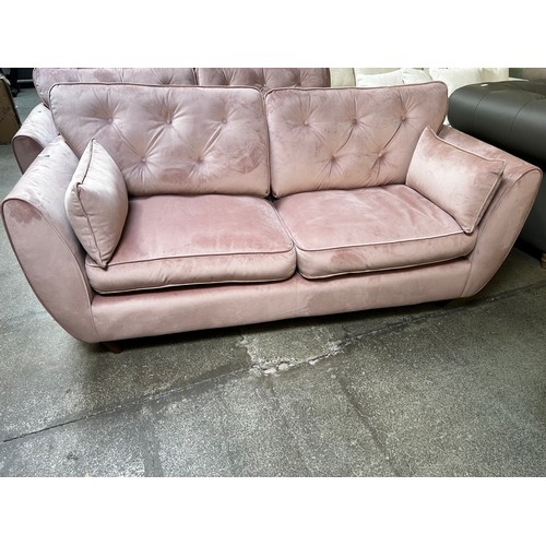 1525 - A Hoxton bubblegum pink button back velvet three seater sofa RRP £799