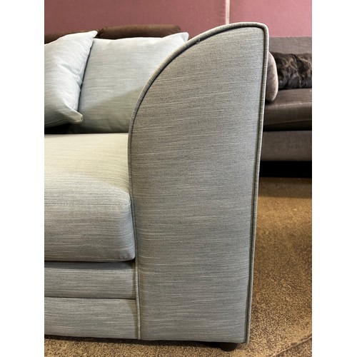 1532 - A sky blue upholstered three seater sofa