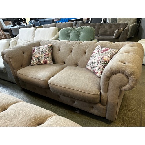 1540 - A beige weave Chesterfield three seater sofa