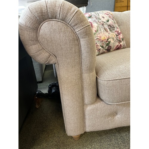 1541 - A beige weave Chesterfield two seater sofa