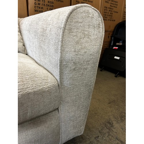 1549 - An off white upholstered open end three seater sofa (missing cushions)