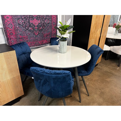 1337 - A Logan circular dining table and four blue Arana chairs