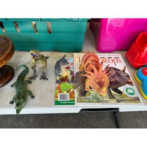 2372 - A large assortment of miscellaneous items including a selection of plastic dinosaur toys, a Natural ... 