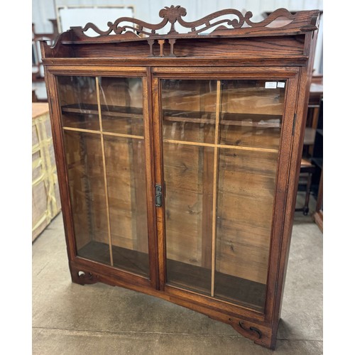 191 - A Victorian carved oak two door bookcase