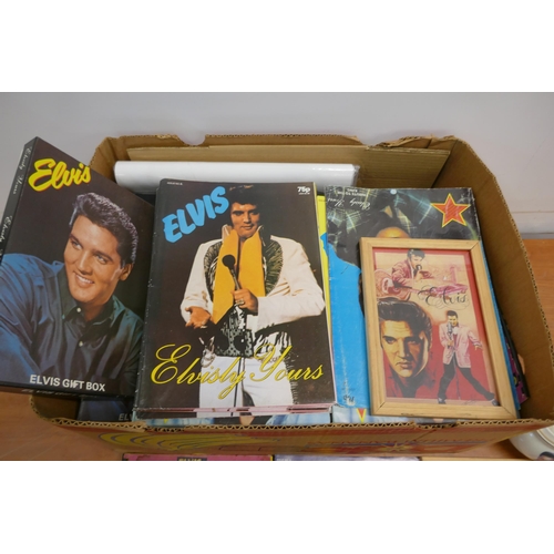 2050 - A crate of Elvis Presley memorabilia including a teapot, black and white prints, wash set, cups, pla... 