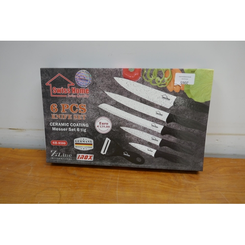 2065 - A Swiss Home 6 piece ceramic coated knife set