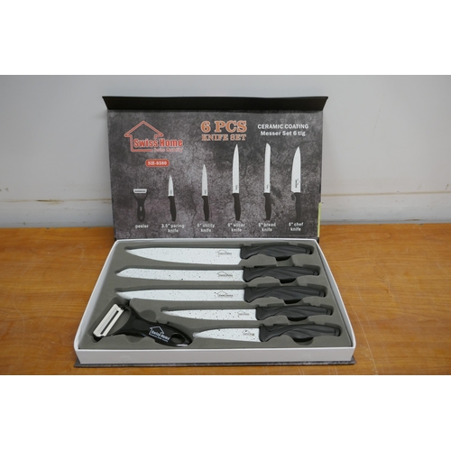 2065 - A Swiss Home 6 piece ceramic coated knife set