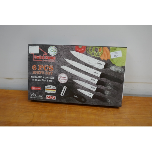 2066 - A Swiss Home 6 piece ceramic coated knife set