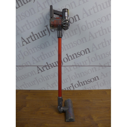 2087 - A Dyson V6 total clean cordless stick vacuum cleaner with attachments and charger