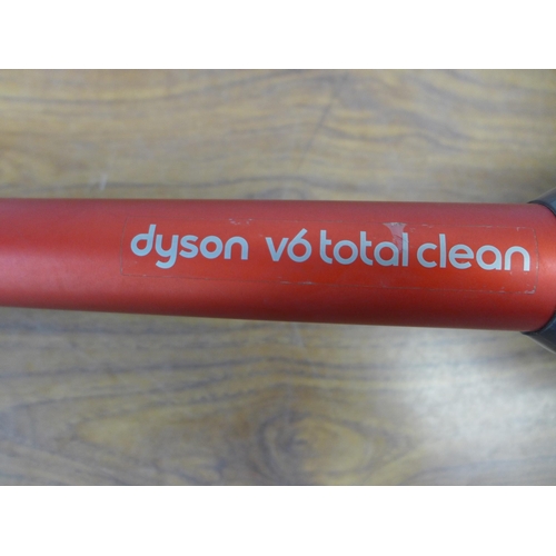 2087 - A Dyson V6 total clean cordless stick vacuum cleaner with attachments and charger