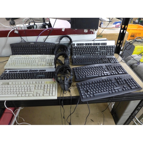 2090 - A large quantity of stereo headphones and a large quantity of assorted computer keyboards including ... 