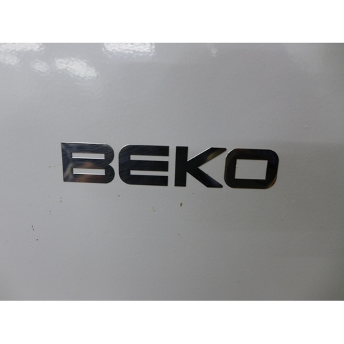 2095 - A Beko model TZ6051W fast freeze free standing 6-section tower freezer