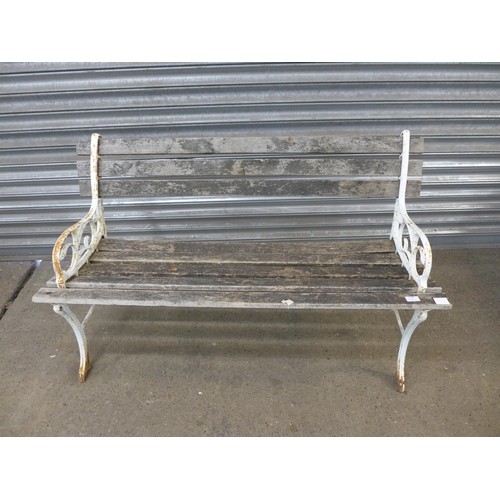 2194 - A wooden garden bench with cast iron bench ends