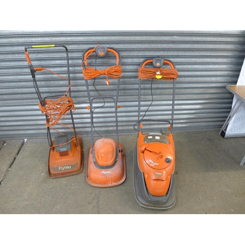 2196 - A Flymo Vision Compact 330 hover lawn mower, a Flymo Sprintmaster XE300 hover lawn mower and a Flymo... 