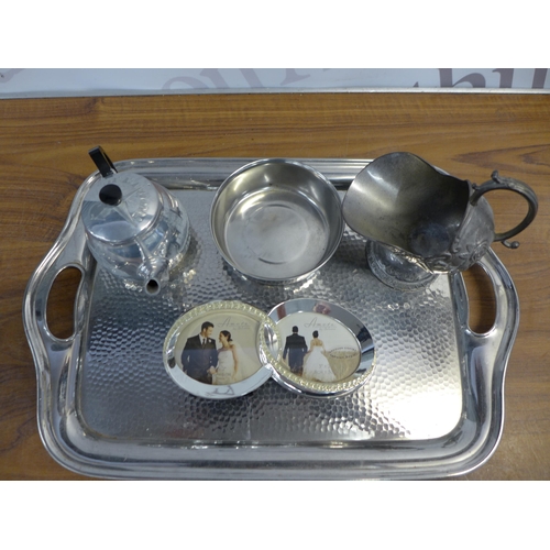 2217 - A crate of mixed silver coloured and silver plated items including photo frames, teapot, candle hold... 