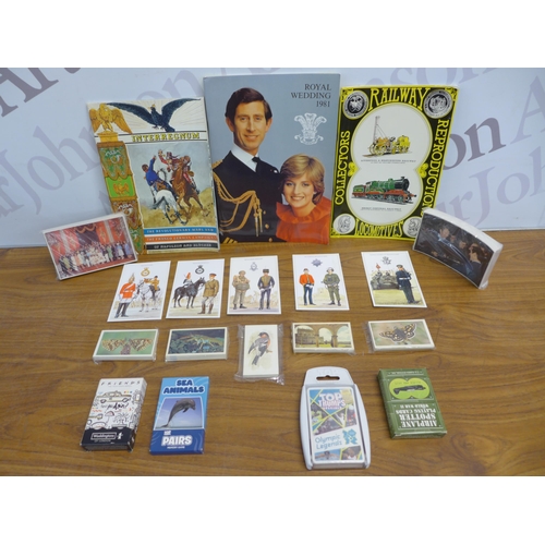 2245 - A box of mixed military postcards and trading card sets including trains and the Royal Family, Grand... 