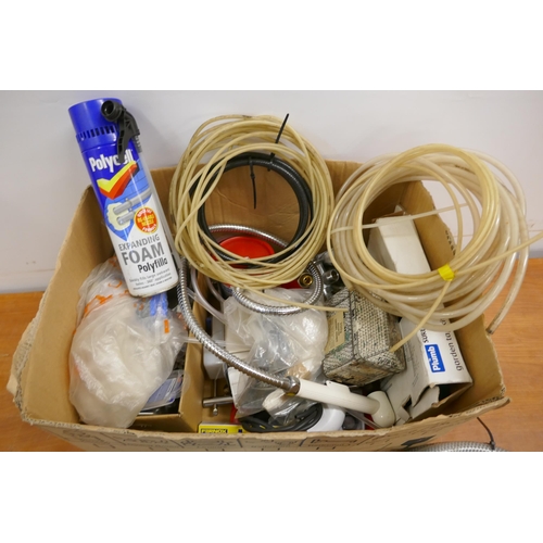 2267 - A box of plumbing accessories/materials including 2 enamel bathroom shelf supports, etc.