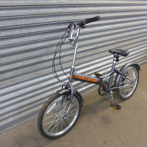 2124 - A Challenge fold up bike and a B'Twin full suspension junior sized bike *AF