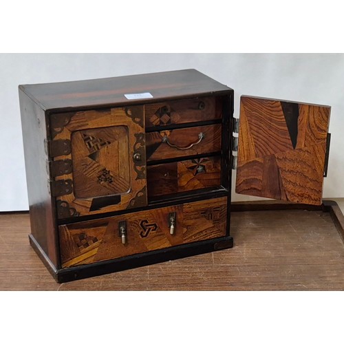 335 - A Japanese Meiji period marquetry table top Kodansu cabinet