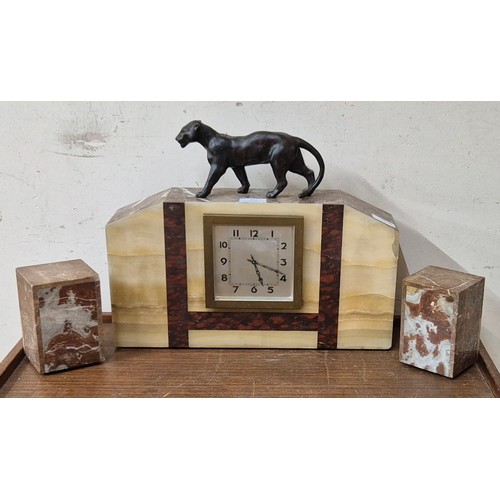 331 - A French Art Deco marble clock garniture