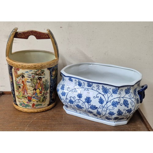 330 - An Oriental jardiniere and blue and white painted pot