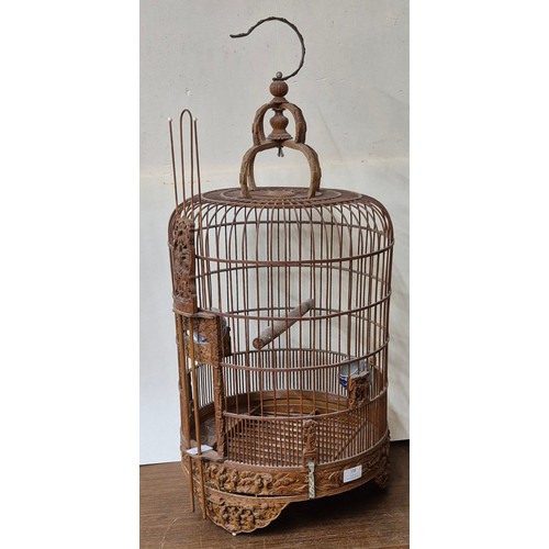 338 - A Chinese carved hardwood bird cage