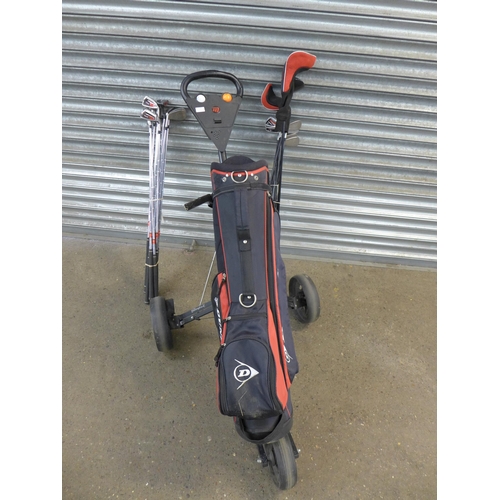 2111 - An MTP-530 golf trolley Dunlop Sport golf bag and various golf clubs including Dunlop Tour stainless... 