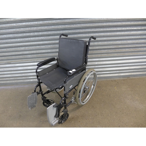 2115 - A Lomax self propelled wheelchair with footrests