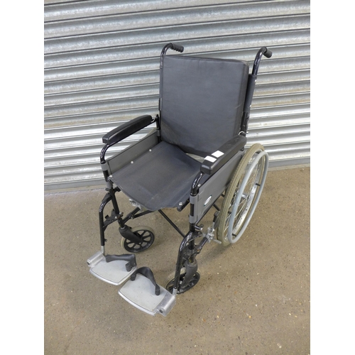 2115 - A Lomax self propelled wheelchair with footrests