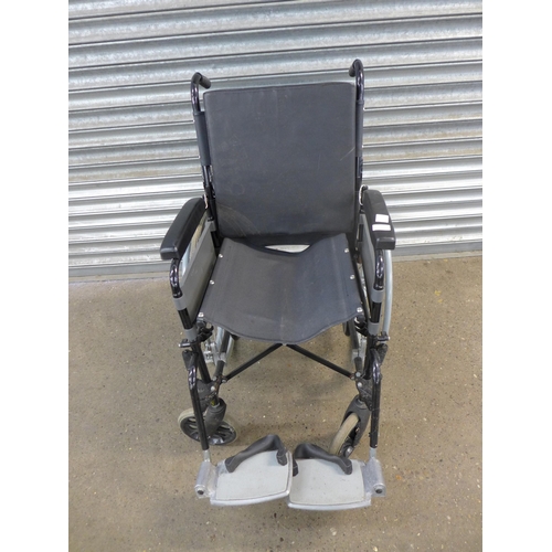 2115 - A Lomax self propelled wheelchair with footrests