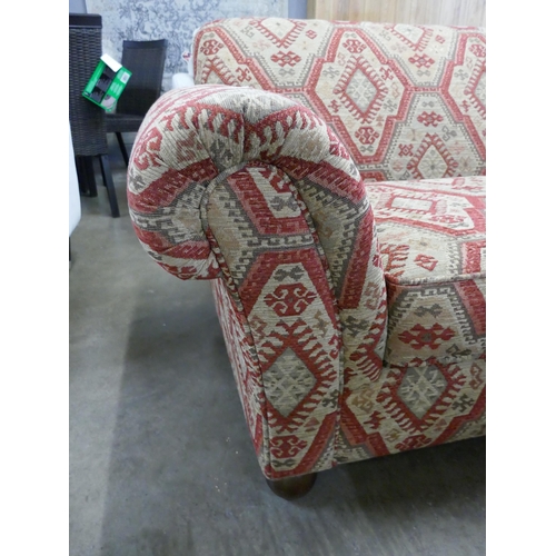 1342 - An aztec design upholstered love seat