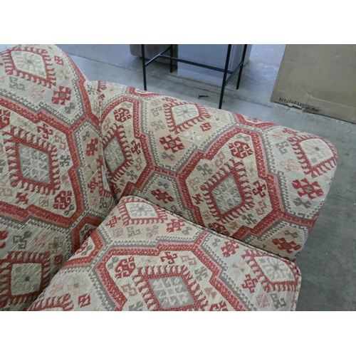 1342 - An aztec design upholstered love seat