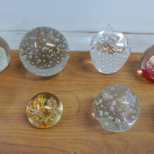 2068A - 10 various sized ornamental glass paperweights