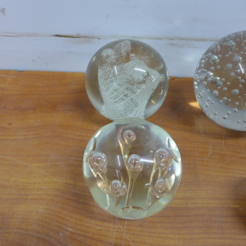 2068A - 10 various sized ornamental glass paperweights