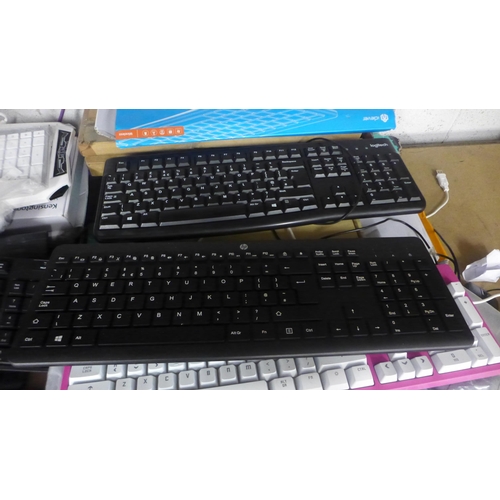 2086 - A quantity of various wireless and wired keyboards including MSI, KROM Barbie themed keyboard, Logit... 