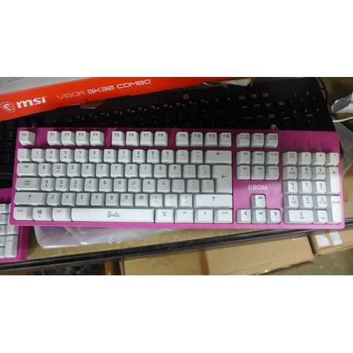 2086 - A quantity of various wireless and wired keyboards including MSI, KROM Barbie themed keyboard, Logit... 