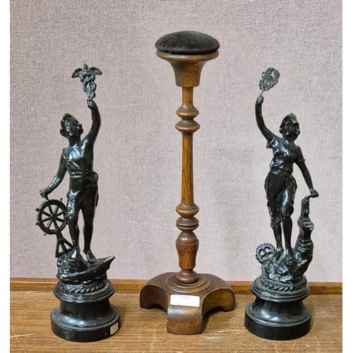 355 - An early 20th Century turned oak hat stand and a pair of French spelter figures