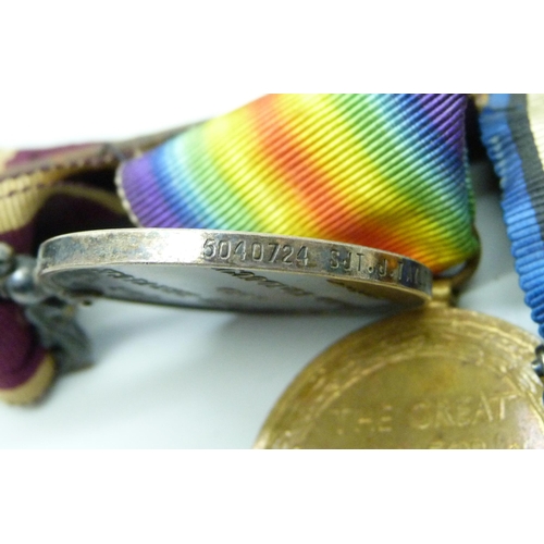 1013 - A group of four WWI medals to 7964 A W O CL 2 J Taylor N Staff R including a For Long Service and Go... 