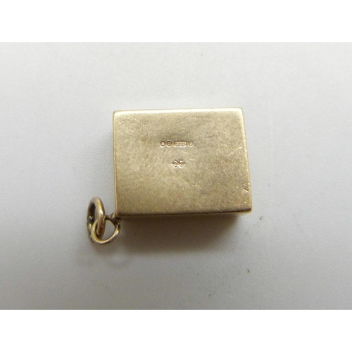 1015 - A 9ct gold 'In Emergency Break Glass' 10 shillings note charm, 2.3g