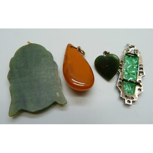 1035 - A jade and white stone set clip converted into a pendant, a coral set pendant and two other pendants