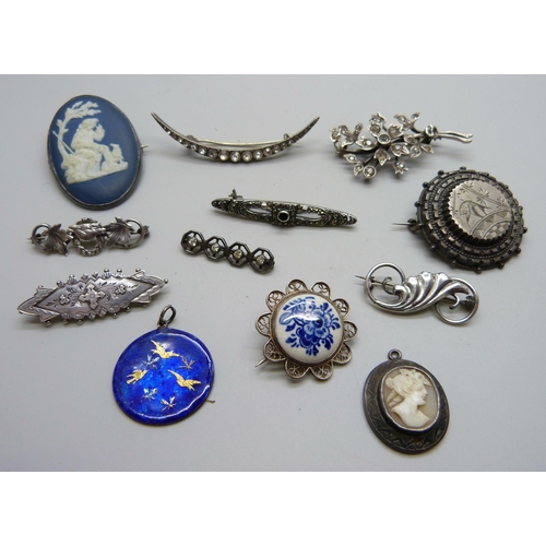 1037 - A Victorian silver brooch, a silver brooch with maple leaf and beaver detail, eight other brooches, ... 