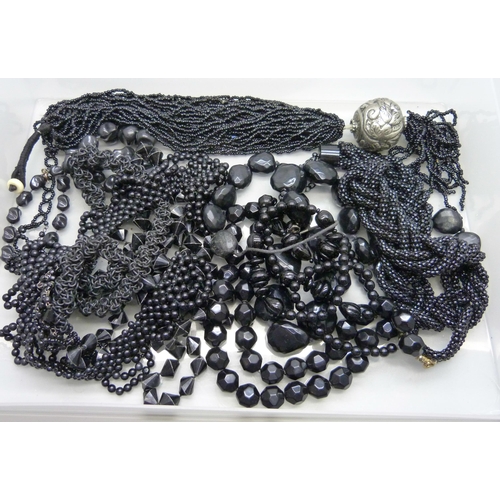 1046 - A collection of black bead jewellery, etc., one necklace requires fastener