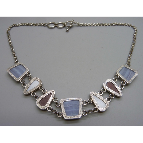 1047 - A silver and multi coloured stone set necklet